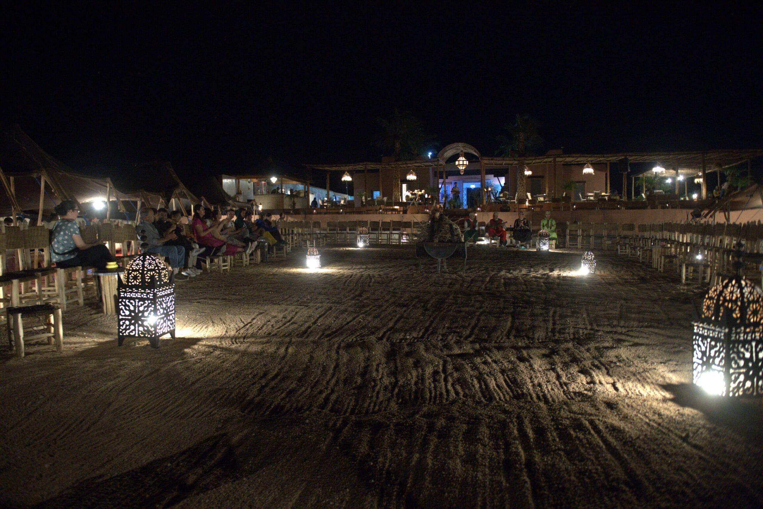 Agafay Desert night with Berber camp, lanterns and starry sky near Marrakech