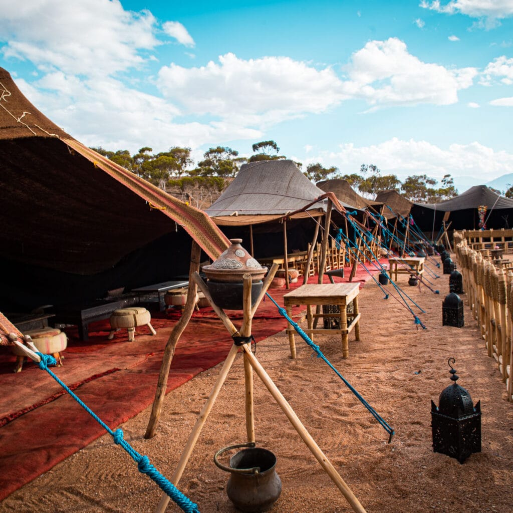 Agafay Desert night with Berber camp, lanterns and starry sky near Marrakech